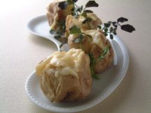 Photo of Baked Potatoes: a quick microwave appetizer recipe provided with nutrition facts for a dinner dish.