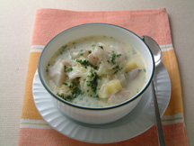 Photo of Cod & Potato Cream Soup: a quick microwave soup recipe provided with nutrition facts for a seafood  dinner soup bowl.