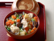 Photo of Tonjiru (a Japanese stew of pork and vegetables): a quick microwave stew recipe provided with nutrition facts for a traditional Japanese soup bowl.