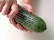 Photo of scoring a cucumber with a fork.