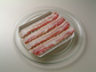Photo of bacon laid ready for microwave cooking.