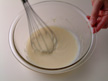 Image of stirring mixture of milk, flour and margarine.