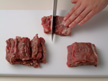 Image of cutting beef into strips.
