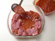 Image of pork chops and meat sauce made ready for microwave cooking.