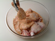 Image of coating the chicken with Tandoori Sauce before microwave cooking.