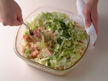Photo of adding lettuce and parsley to cooked rice.