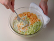 Image of stirring the mixture after adding leeks, cheddar cheese, salt, and pepper.