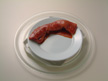 Image of pork made ready for microwave cooking.