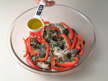 Image of mussels, shrimp, and red bell pepper layered ready for microwave cooking.