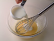 Image of adding milk to whipped egg.