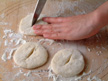 Image of cutting a 2-inch opening at a tamped dough's center.