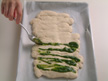 Image of spreading basil paste on top of strips.